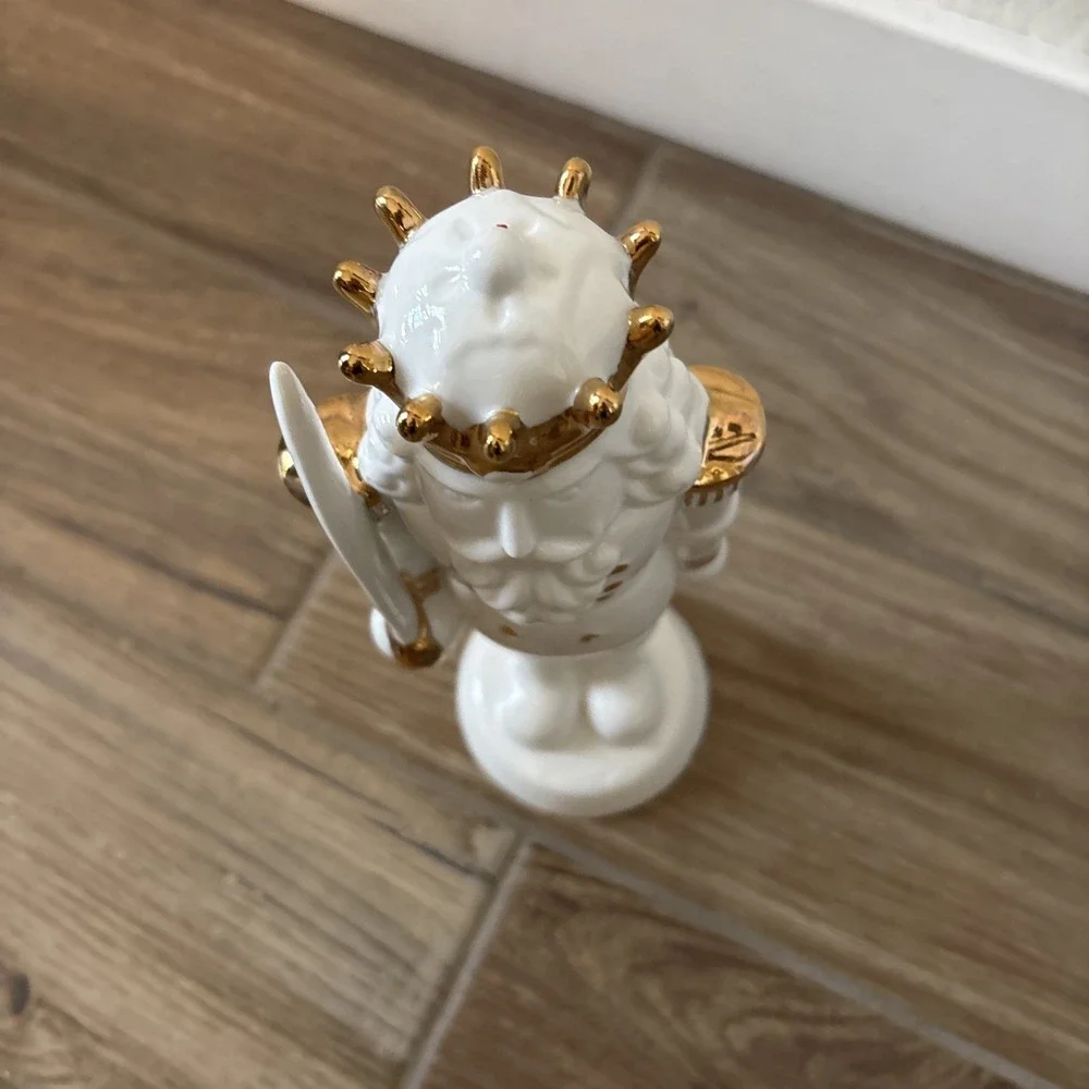 White Porcelain Nutcracker with Gold Trim Form The Holiday Aisle Figurine